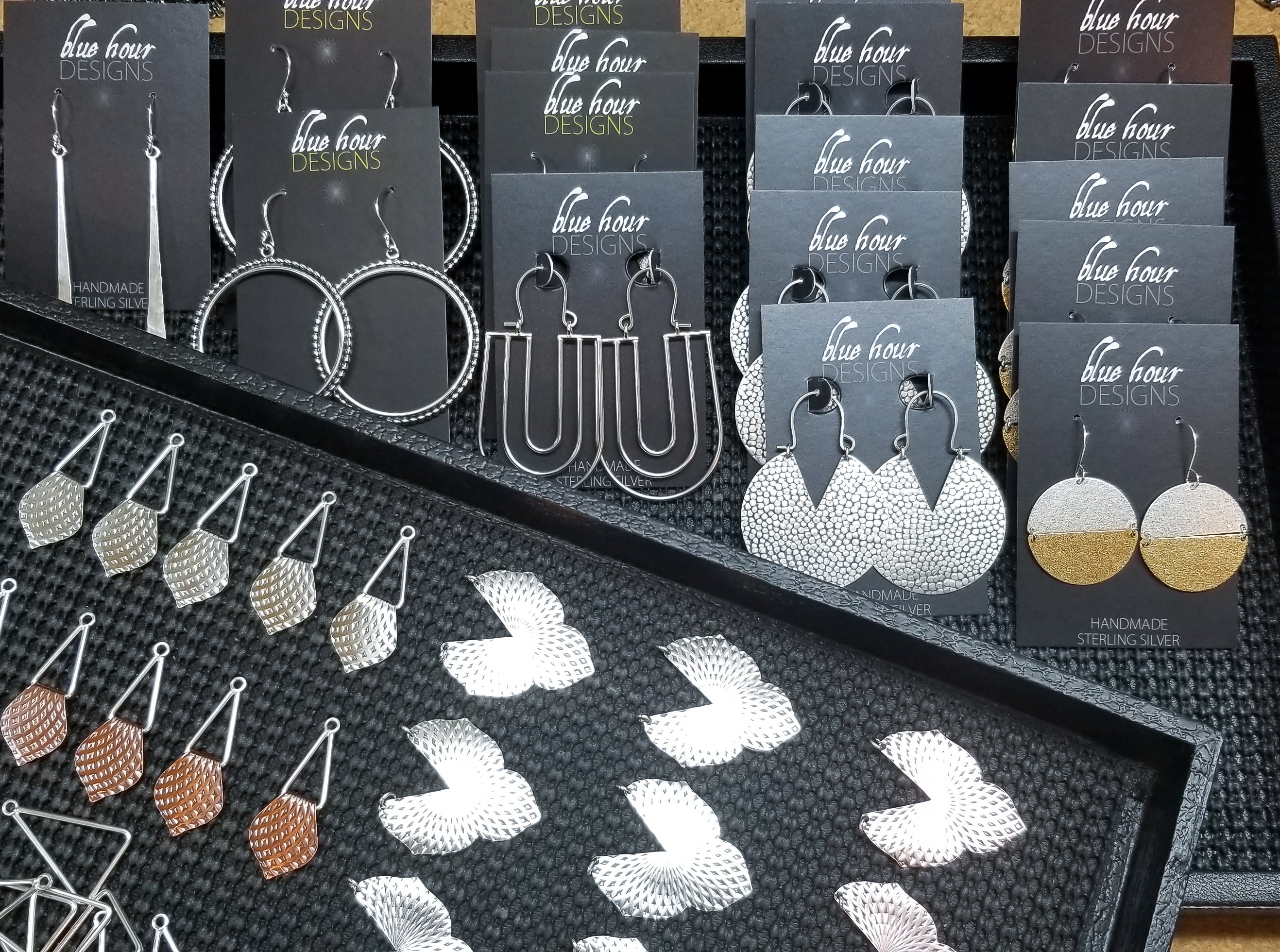A collection of various blue hour designs silver and mixed metal earrings